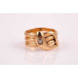 A yellow metal and diamond snake ring, possibly French, set with an old mine-cut diamond of