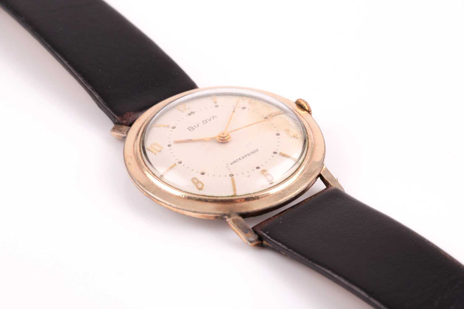 A Bulova mechanical wristwatch, the silvered dial with slim gilt numerals, in a gold cased case, - Image 10 of 12