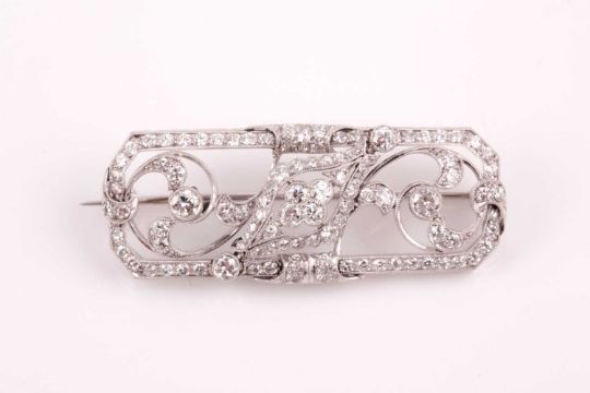 A platinum and diamond plaque brooch, of foliate design, inset with round-cut diamonds, total - Image 1 of 6