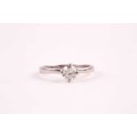 A platinum and diamond solitaire ring, set with a round brilliant-cut diamond of approximately 0.