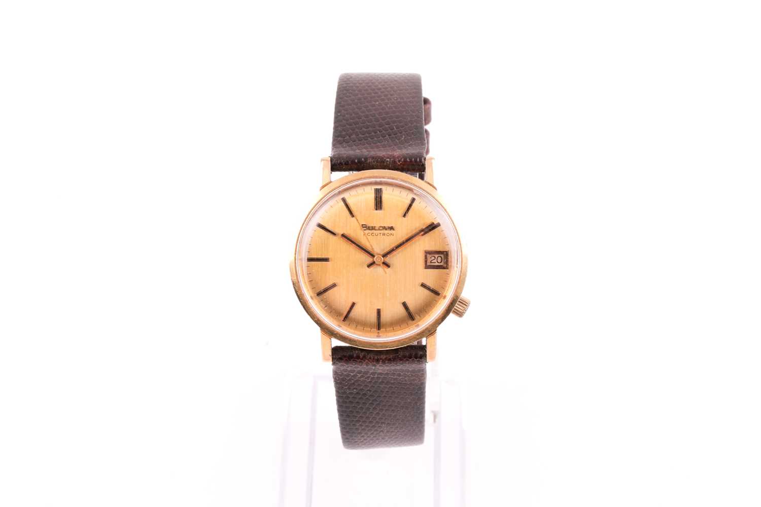 A Bulova Accutron 9ct yellow gold electronic wristwatch, with gilt dial, black baton indices and