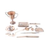 A mixed group of small silver and white metal items, comprising a twin-handled presentation