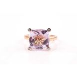 A 9ct yellow gold and pale pink kunzite ring, set with a mixed square-cut chequerboard faceted