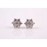 A pair of 18ct white gold and diamond stud earrings, each floral cluster set with round brilliant-