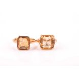 A yellow metal and citrine ring, set with a mixed rectangular-cut dark yellow citrine, four-claw