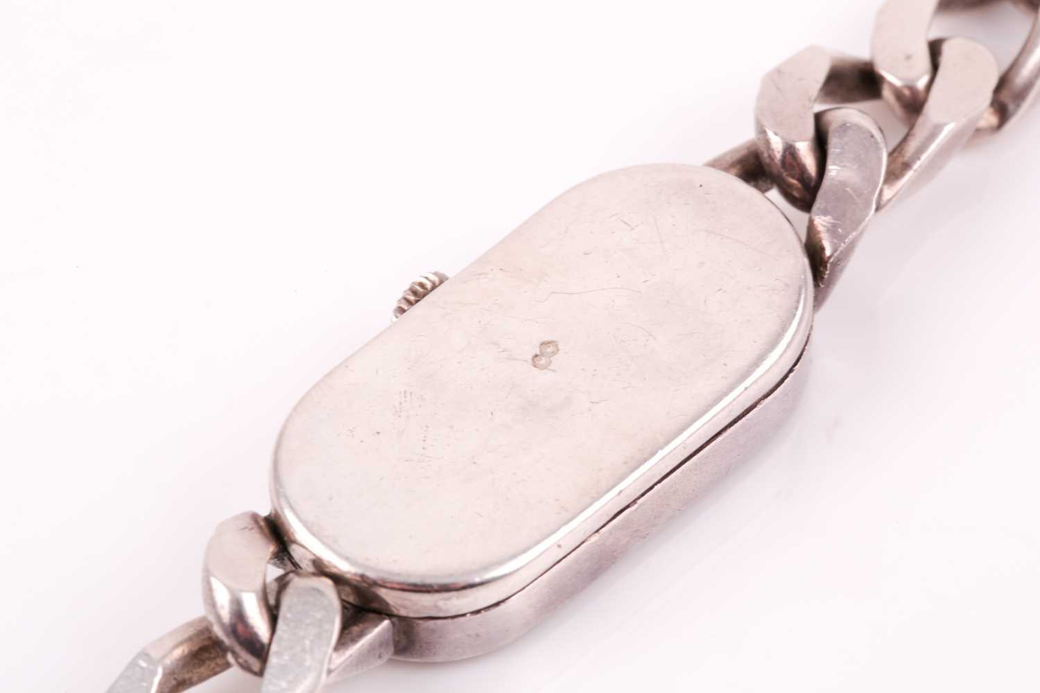 Asprey. A lady's silver wristwatch, the elongated oval brushed silvered dial with simple arrowhead - Image 15 of 18