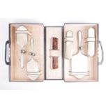 An Art Deco period silver and guilloché dressing table set, in fitted carry case, London 1933 by