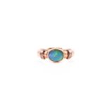 A 9ct yellow gold and doublet opal ring, rubover-set with a flat oval opal, showing good green and