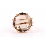 A 9ct yellow gold and citrine ring, set with a chequerboard faceted round-cut citrine, approximately
