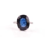 An early to mid 20th century sapphire ring, set with a mixed oval-cut synthetic blue sapphire, six