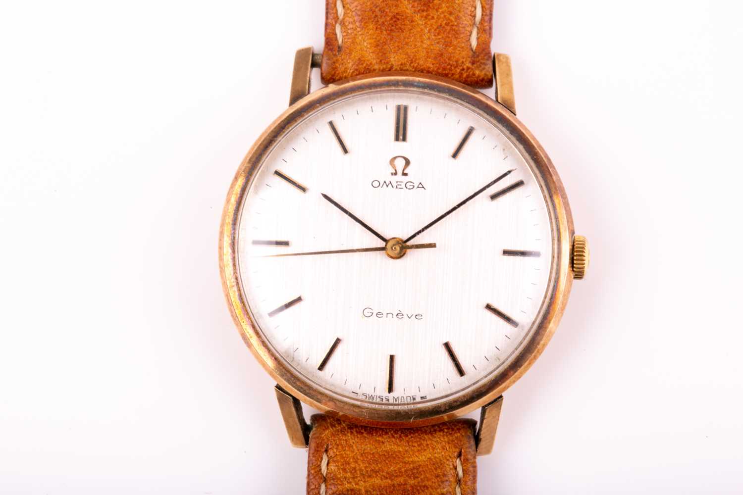 Omega. A gentleman's 9ct gold Geneve wristwatch, the brushed circular dial with baton indices and