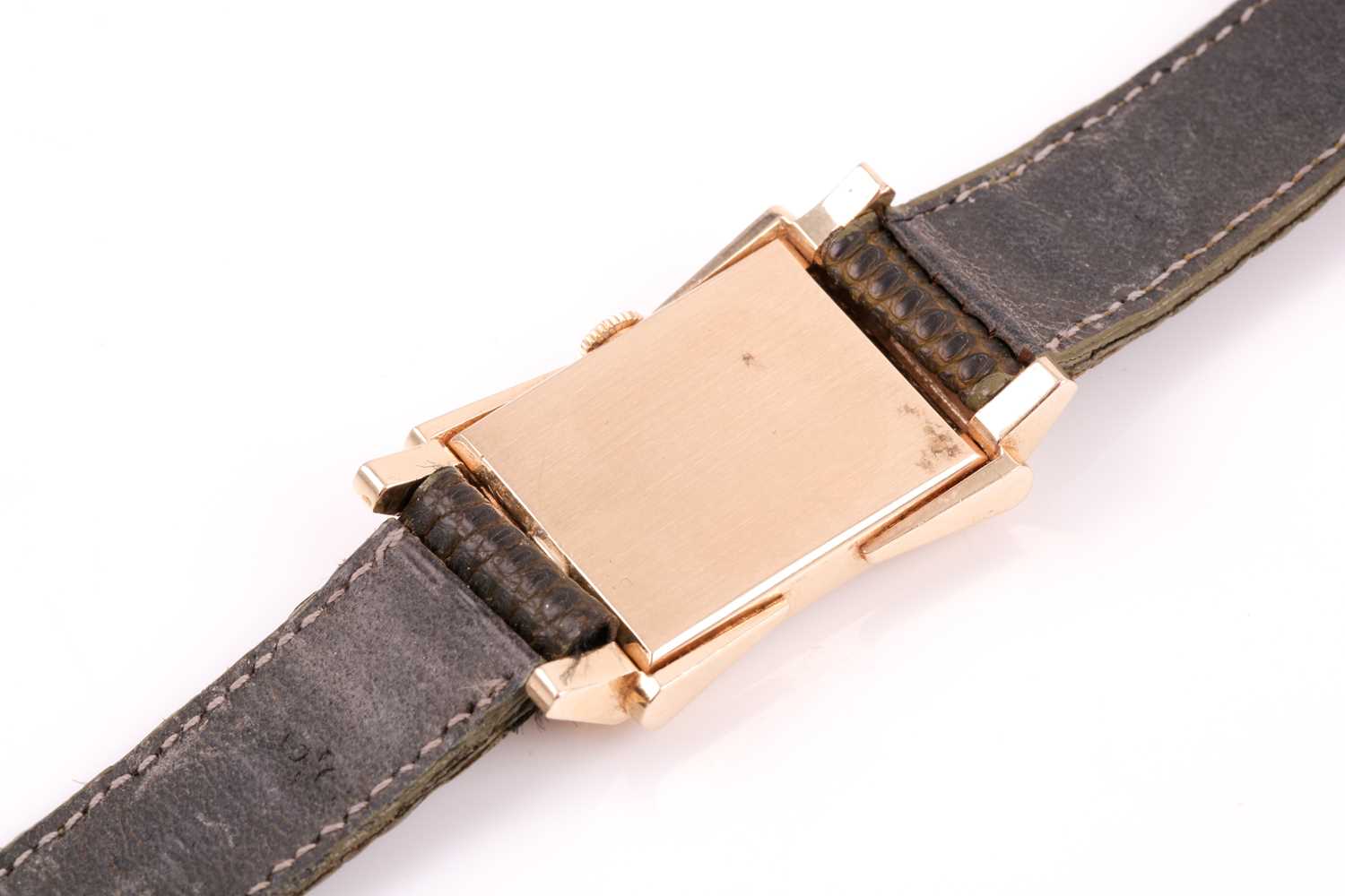 Omega. A rectangular gold cased 1940's wristwatch, the signed silvered dial with applied gilt dart - Image 4 of 6