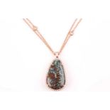 A rose gold, diamond, and boulder opal necklace, the pendant set with a green boulder opal within