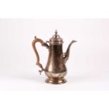 A silver coffee pot, Tessiers Ltd, London 1971, in the Geo III style, with wood scroll capped