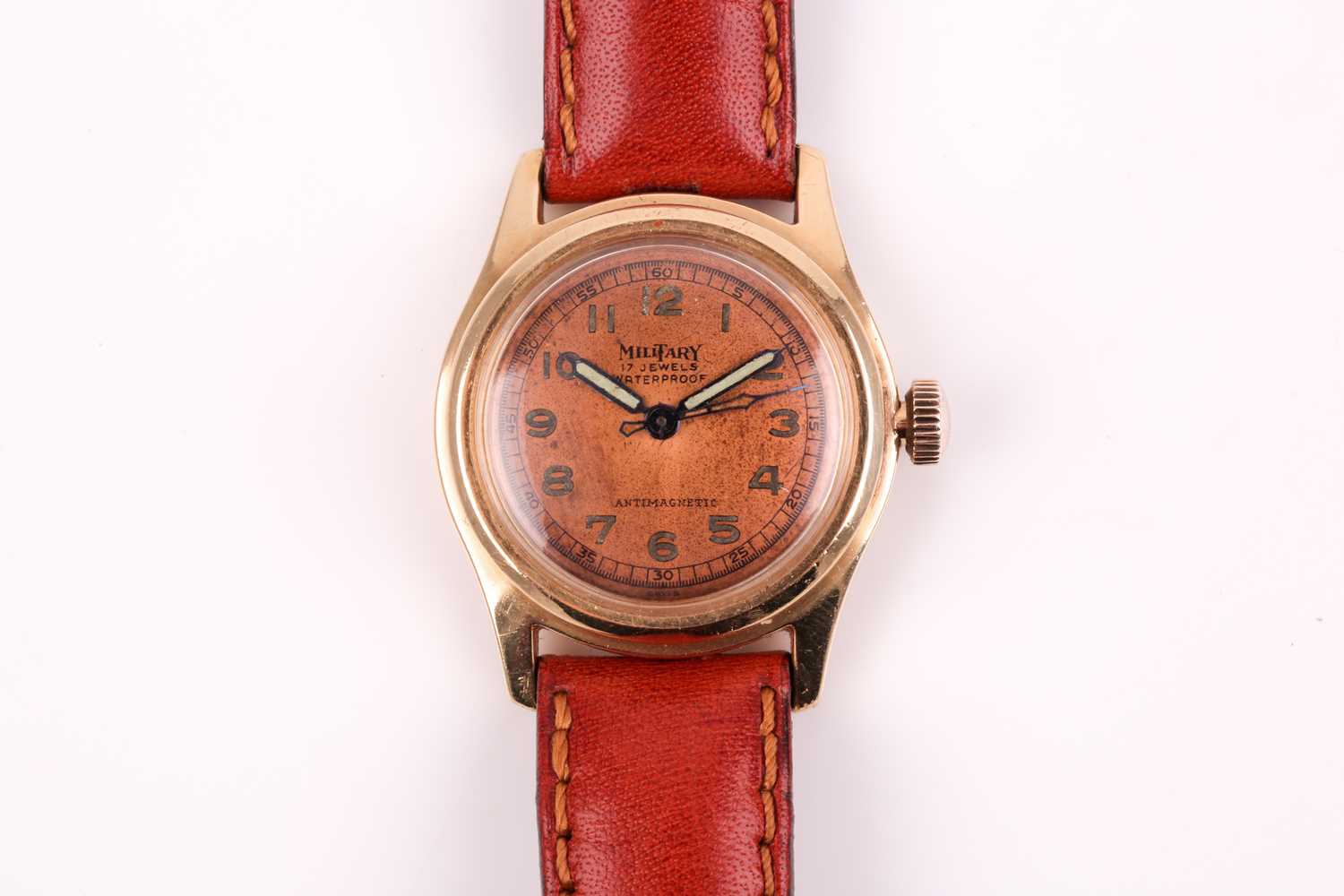 A vintage military style watch, the circular brushed copper dial with Arabic indices, outer minute