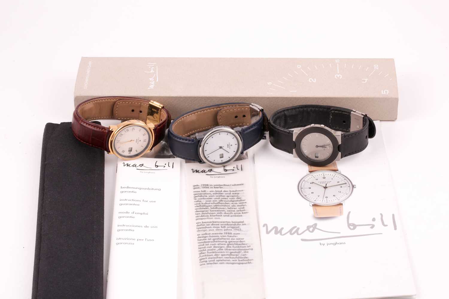 A group of threeJunghans quartz wristwatches, with an extra box and paperwork. (3)