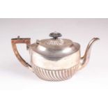 A Victorian silver teapot, Sheffield 1896 by Howard and Hawksworth, oval, part fluted with fluted