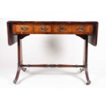 A George III style figured rosewood two flap sofa table with two frieze drawers, on end stile