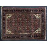 A 20th century Lilihan? rug with a central lozenge field of stylized herat motif within multiple