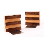 John Makepeace (B.1939), a pair of satin birch and hardwood veneered bookends, on a stainless