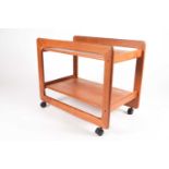 A Danish teak trolley by Tarm Stole OG Mobelfabrik, mid 20th century, on black plastic castors,