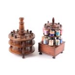 A Victorian figured rosewood cotton reel stand with a turned carousel and spindle retainers. The