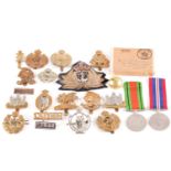 A small collection of military cap badges, to include Artists, Artist Rifles, Royal Armoured Corp,