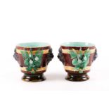 A pair of late 19th-century majolica planters, in the style of Minton, with relief lion mask and