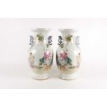 A pair of large Chinese Famille rose porcelain baluster vases with pieced cloud handles. Probably