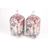 A pair of Arita Imari square vases, circa 1900, based upon gin bottles of the 17th century, the neck