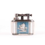 A Lucas Dunhill silver plated table lighter, having dual rampant lions upon a blue and silvered