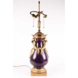 A large Chinese flambe glazed vase with French ormolu mounts, the sang de boeuf glaze with