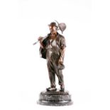 J M Picciole (19th/20th century), 'Retour Au Foyer', a large bronze figure of a weary miner, wearing