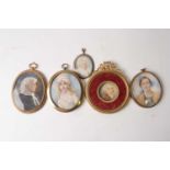 An 18th century portrait miniature on ivory, in a yellow metal case (6.8 cm x 4.5 cm), the sitter