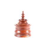 An early 19th century Dutch turned mahogany treen tobacco box. Of finial form with simple push-fit