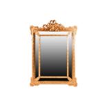 A 19th-century Venetian style carved wood and gilt gesso, rectangular cushion frame wall mirror.