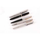 A group of five fountain pens, comprising: a Parker Duofold (14K nib), a Parker pen with gold nib,