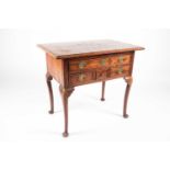 An early 18th-century regional fruitwood, elm, ash and walnut parquetry topped lowboy, the first