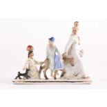 A Soviet Russian porcelain figure group of an Eastern family in procession with a young man on a