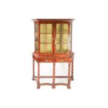 A William & Mary style walnut display cabinet on stand of canted rectangular form. The upper section