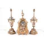 An early 20th-century gilt metal 8-day mantle clock garniture by Japy Freres & Cie. The