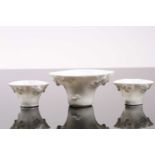 Three Chinese blanc de chine libation cups, 19th/20th century, each of typical form, with moulded