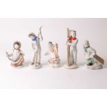 A Lomonosov Russian porcelain figure of a Skier holding her skis together with her male companion