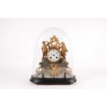 A late 19th century 8 day gilt metal mantle clock with figural mounts. Under a glass dome with