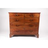 A Geo III mahogany chest of drawers, the top with applied moulded edge, above two short and three