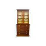 A George III mahogany secretaire bookcase. The upper section with a pair of geometrically glazed