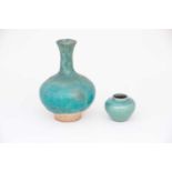 A Kirman bottle vase, 17th/18th century, the bulbous body and flared neck under a crazed turquoise