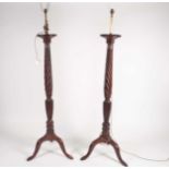A pair of George III mahogany bedpost standard lamps. With tripod supports. 171 cm highCondition
