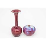 A Chinese globular vase, 20th century, the body in a purple, red and white glaze, feathering down