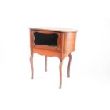 A French Louis XVI style kidney shaped mahogany bijouterie table with marquetry inlaid topabove a
